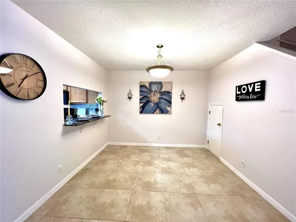 a view of a livingroom with a kitchen
