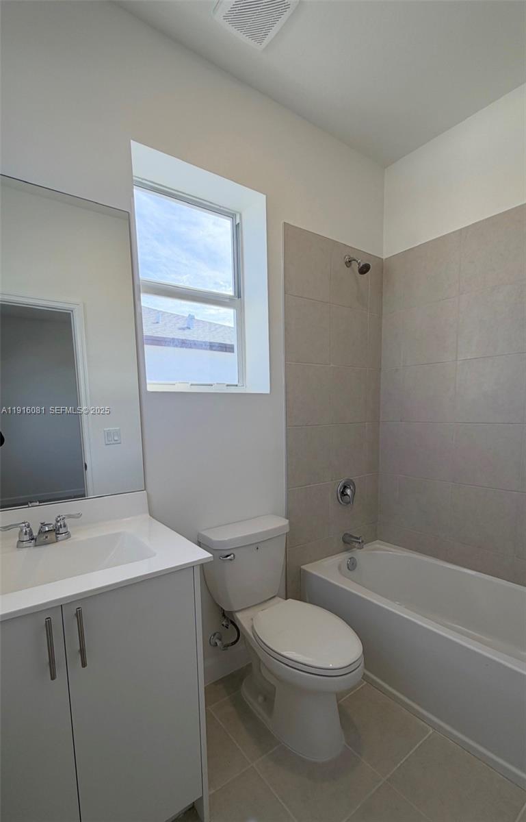 15584 Southwest 276th Terrace Homestead, FL 33031 - Photo 8 of 10 a bathroom with a sink a toilet and shower