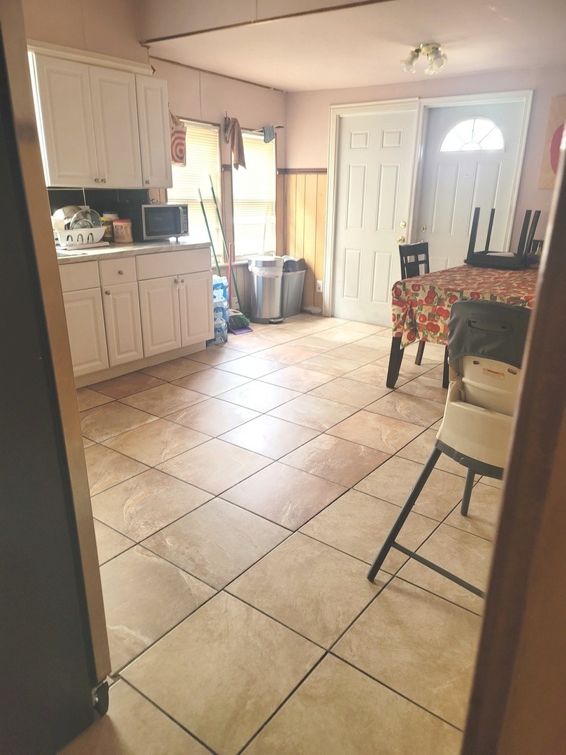 2240 North Monitor Avenue Chicago, IL 60639 - Photo 5 of 8 a large room with a large window and glass door