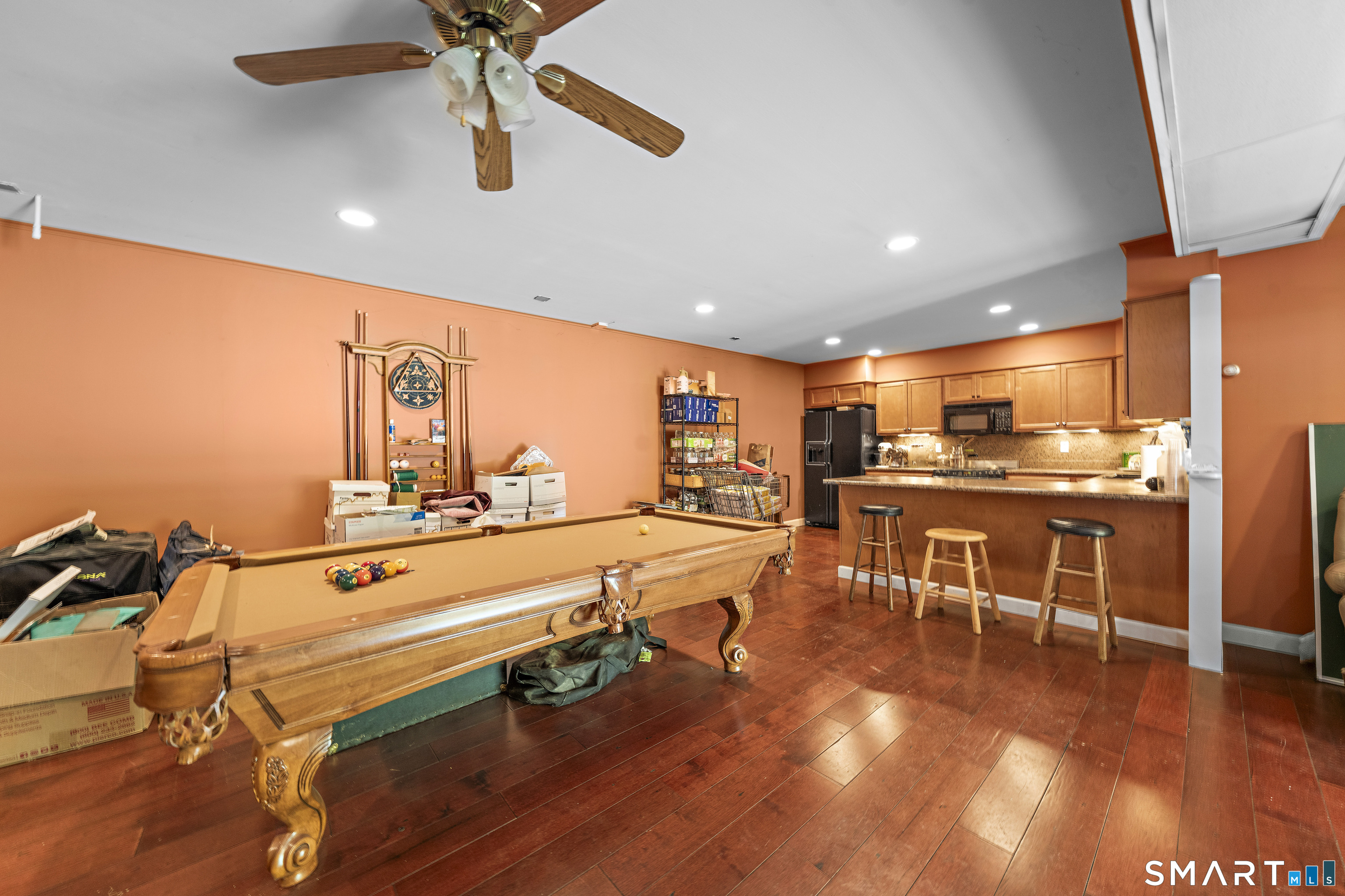 80 Holmes Road Goshen, CT 06756 - Photo 33 of 40 a room with stainless steel appliances lots of wooden furniture dining table and chairs