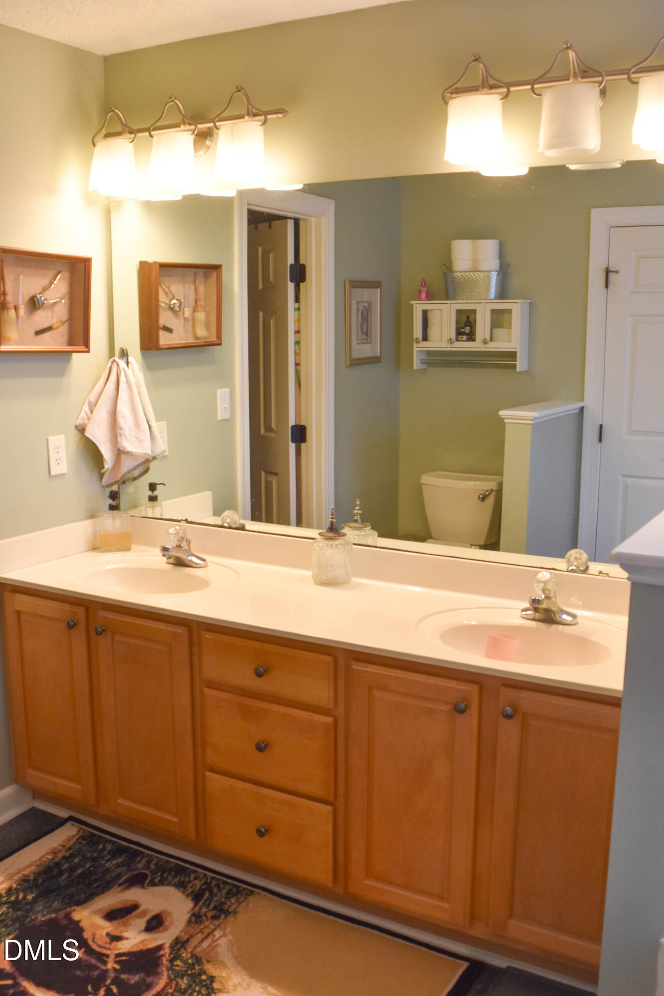 5908 Deep Spring Circle Wake Forest, NC 27587 - Photo 25 of 51 a bathroom with a sink and a mirror