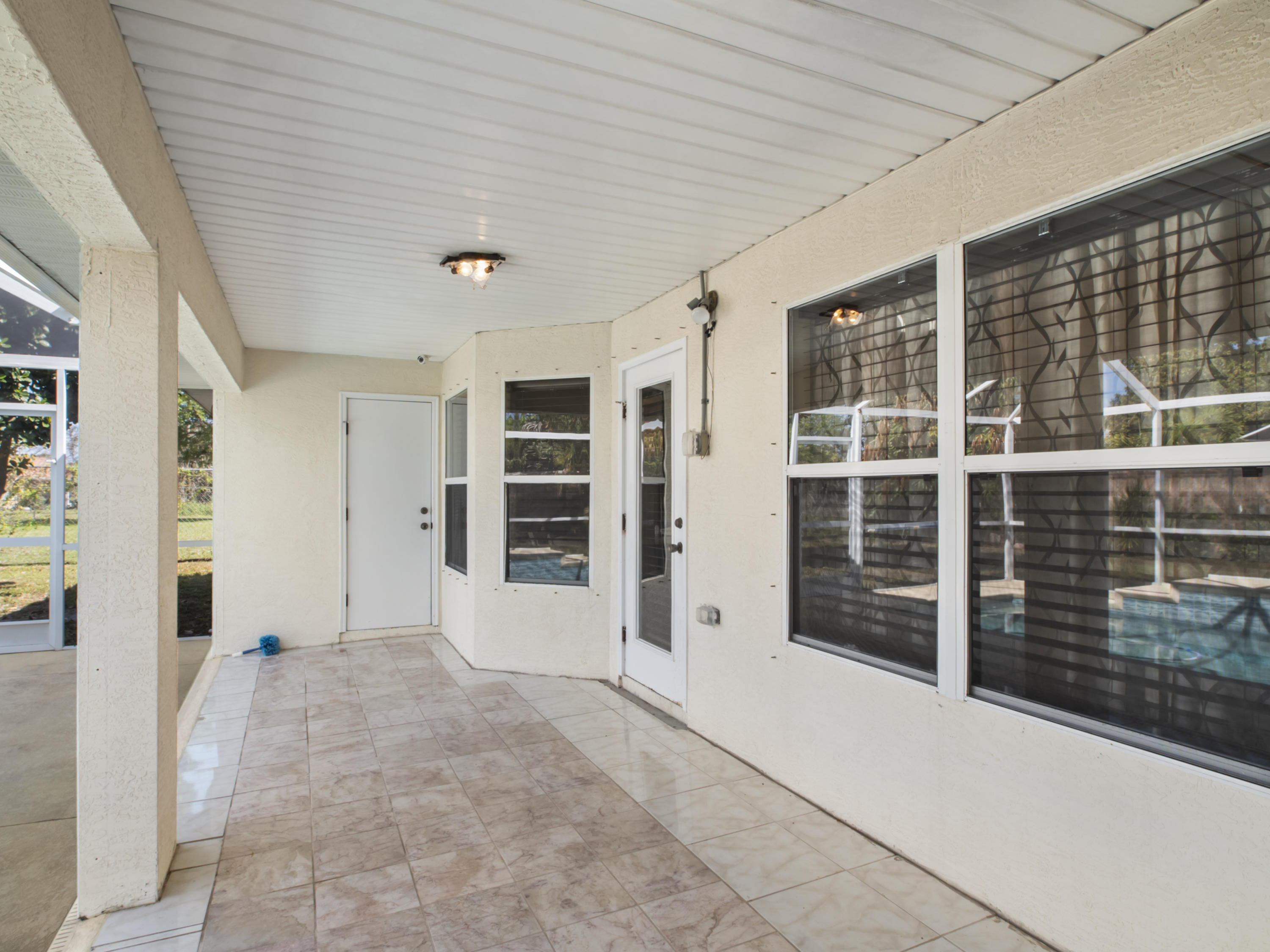 165 Southwest Covington Road Port St. Lucie, FL 34953 - Photo 22 of 26 a view of an empty room with a window