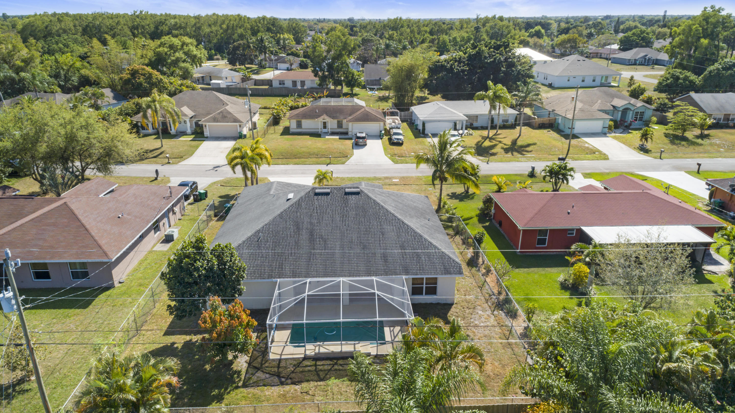 165 Southwest Covington Road Port St. Lucie, FL 34953 - Photo 3 of 26 an aerial view of residential houses with outdoor space