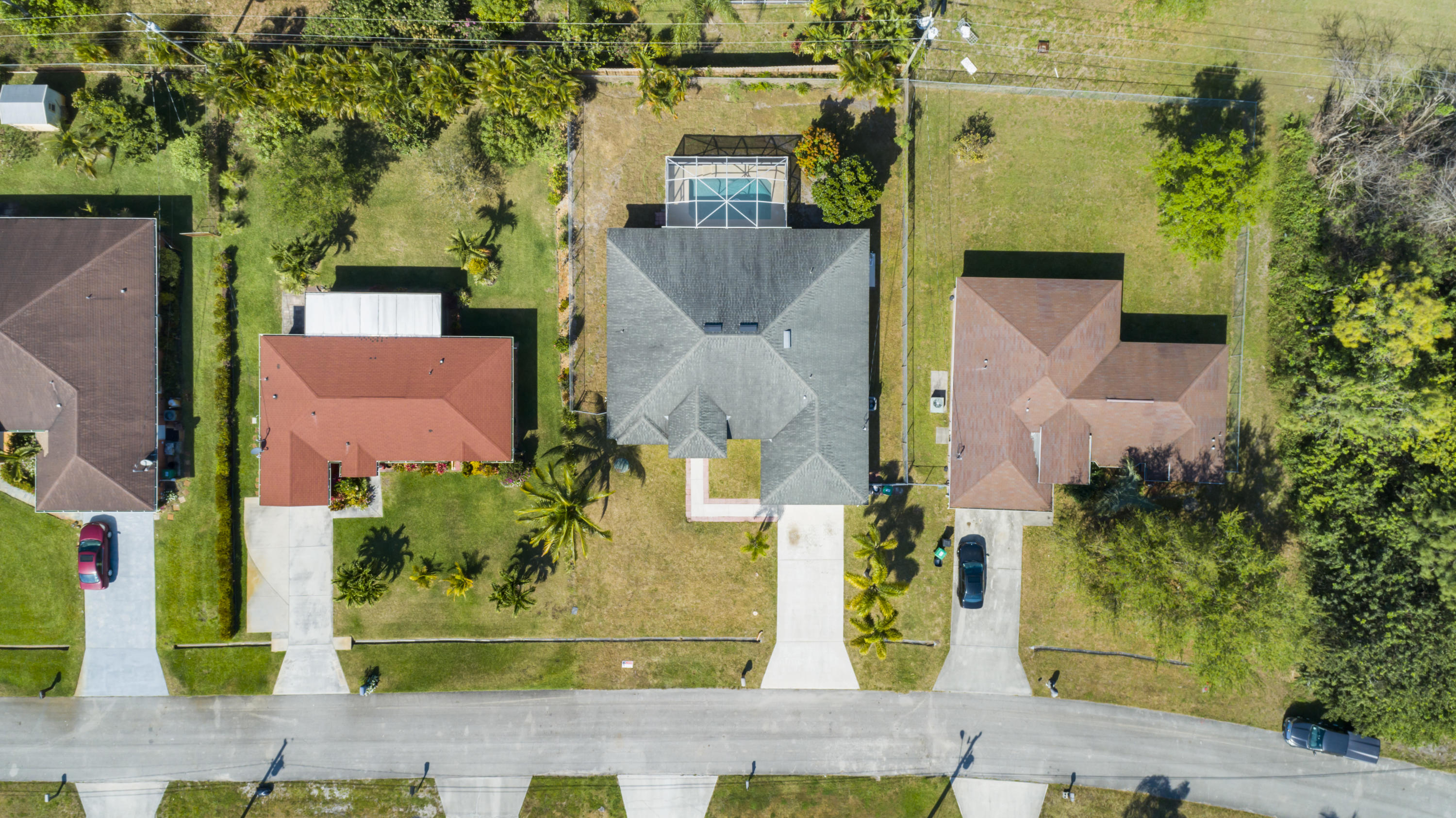 165 Southwest Covington Road Port St. Lucie, FL 34953 - Photo 4 of 26 an aerial view of residential houses with outdoor space