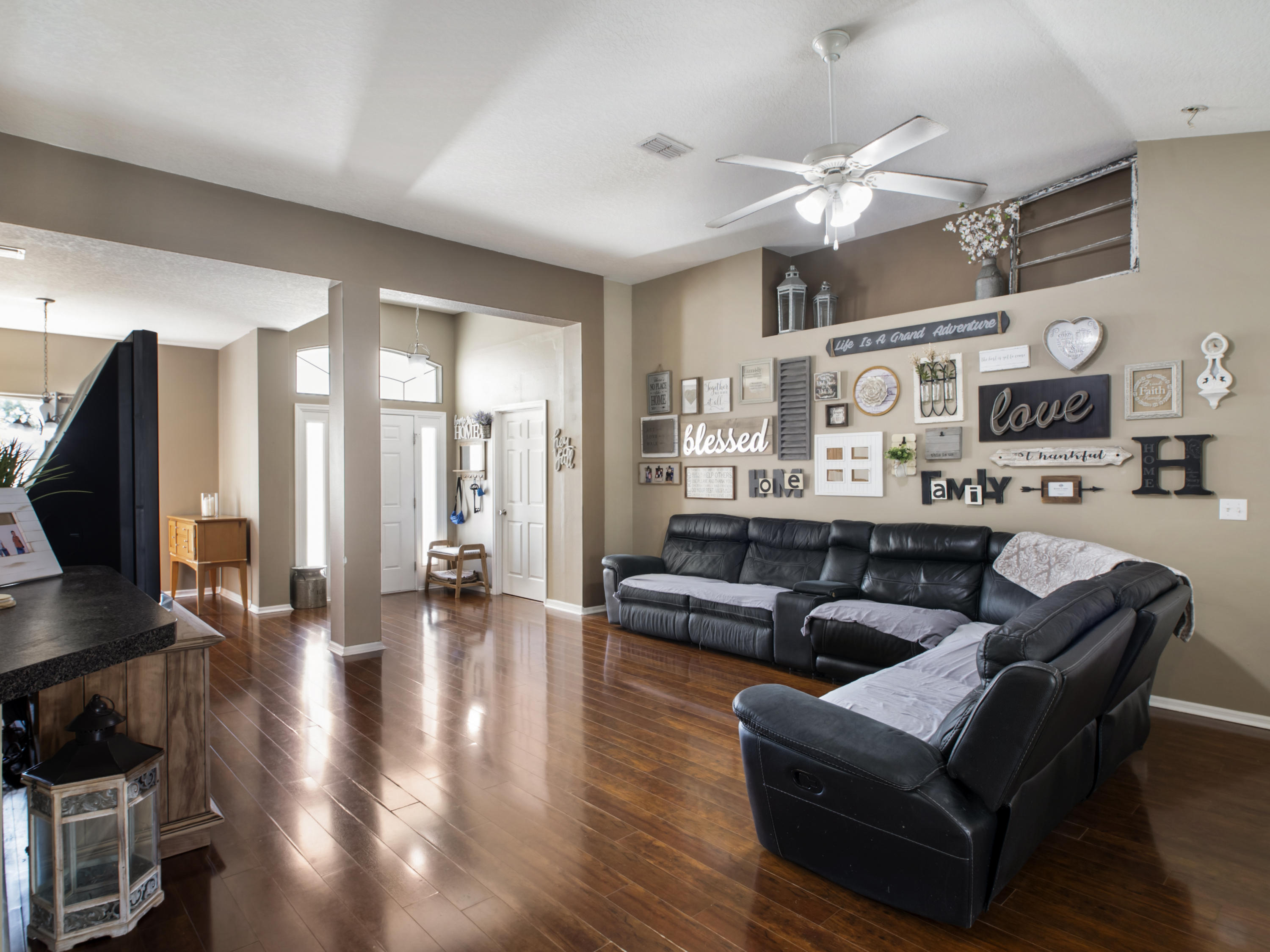 165 Southwest Covington Road Port St. Lucie, FL 34953 - Photo 8 of 26 a living room with fireplace furniture and a flat screen tv