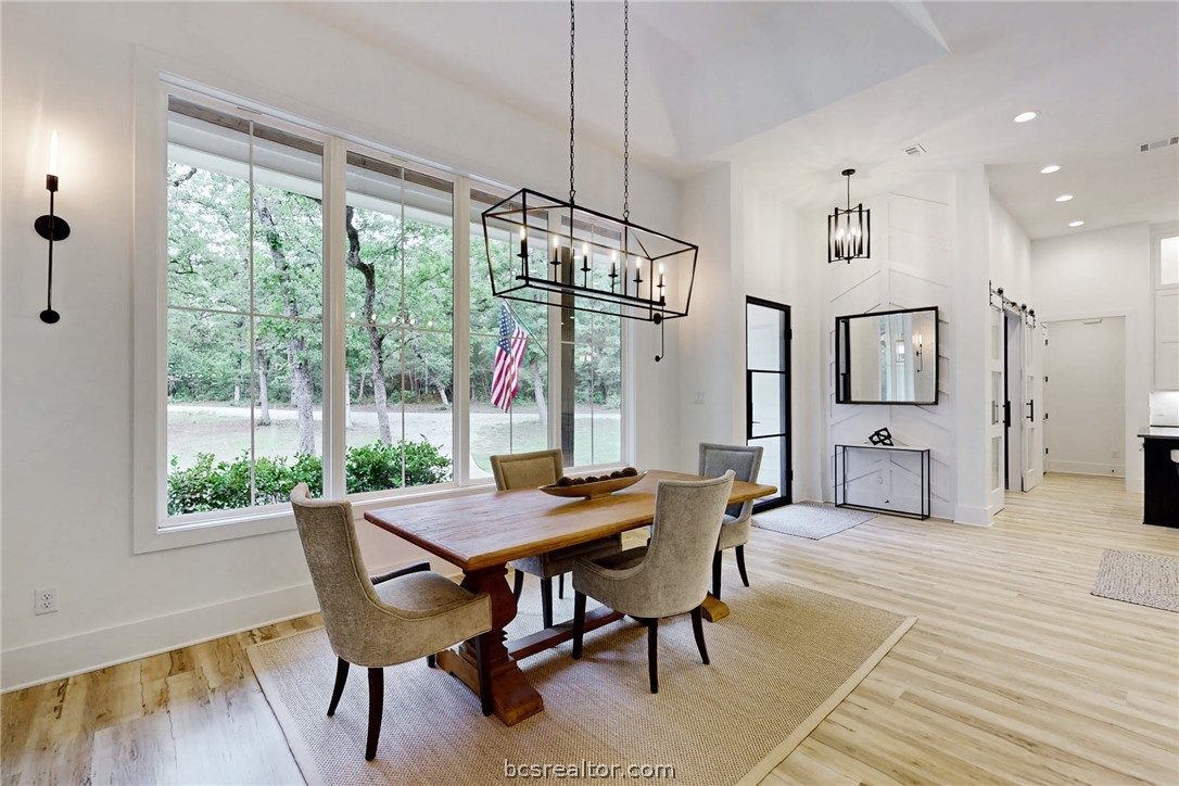 1629 Sawmill Road Franklin, TX 77856 - Photo 13 of 47 a view of a dining room with furniture window and wooden floor