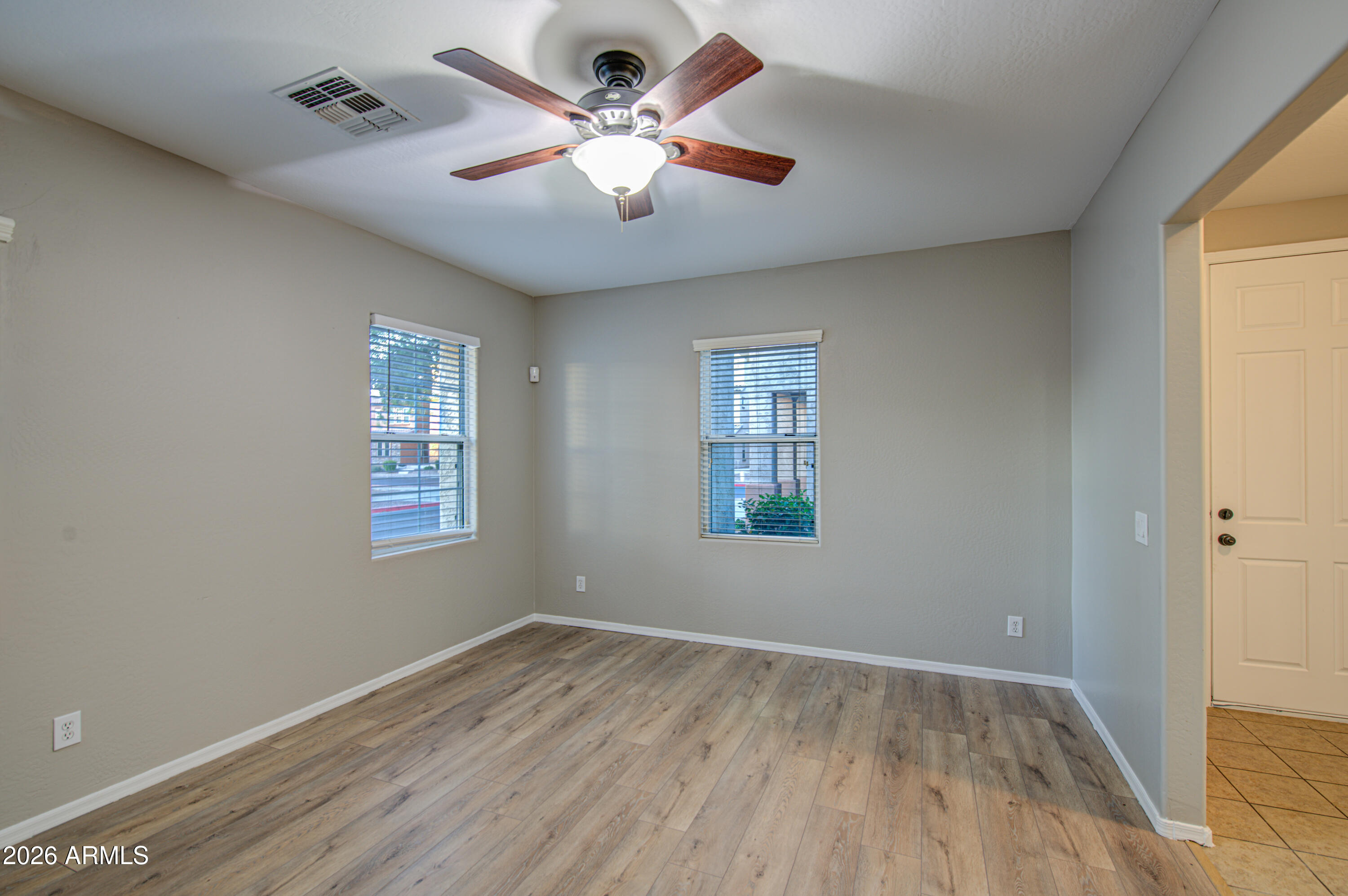7759 West Monte Vista Road Phoenix, AZ 85035 - Photo 6 of 43 a view of an empty room with a window