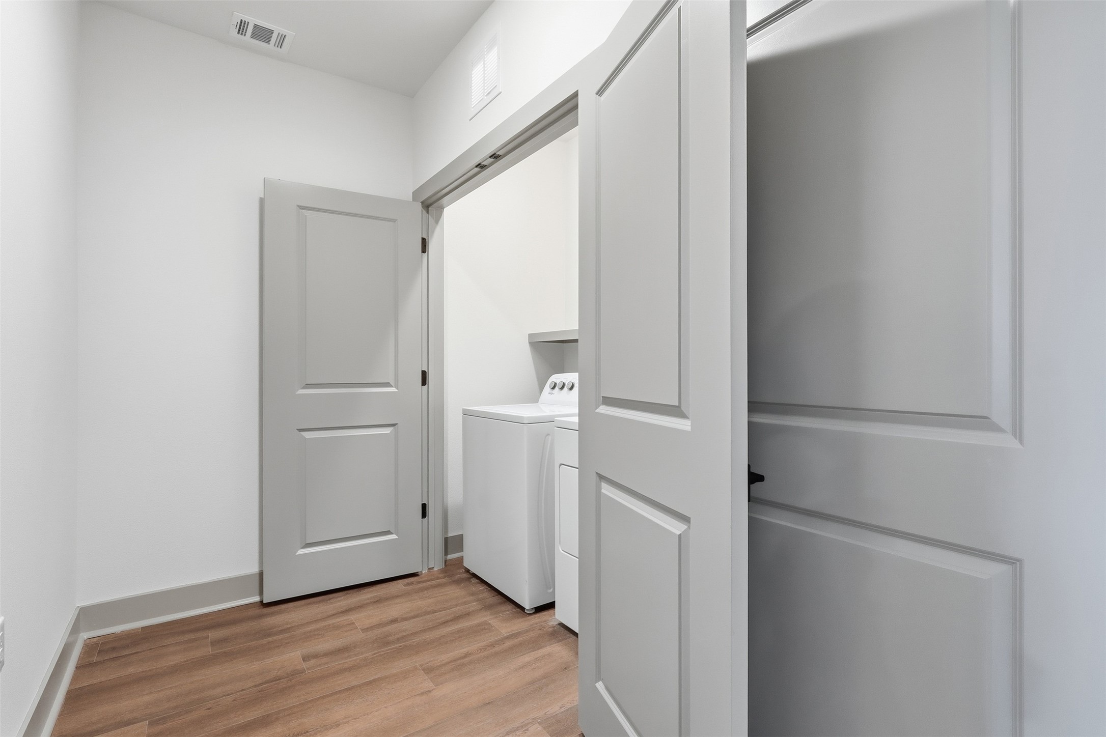 1950 Winrock Boulevard, Unit B2 Houston, TX 77057 - Photo 3 of 32 a view of a hallway with wooden floor