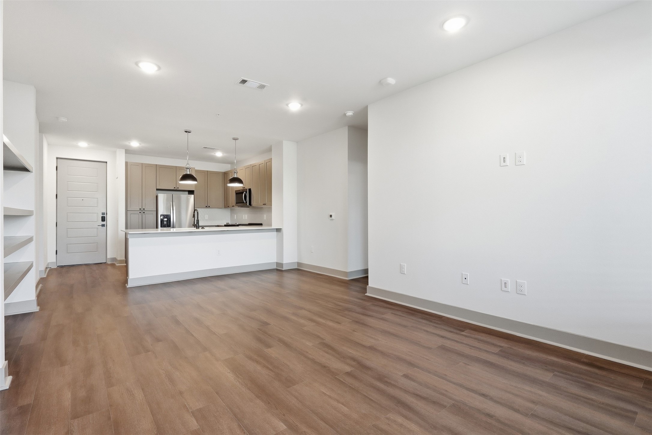 1950 Winrock Boulevard, Unit B2 Houston, TX 77057 - Photo 6 of 32 a view of a kitchen with a sink and a refrigerator
