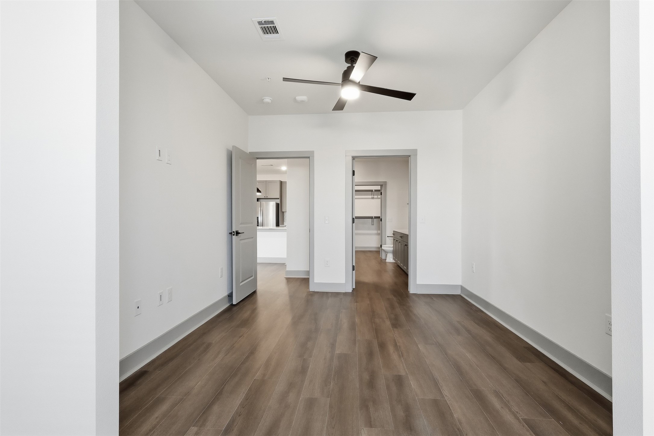 1950 Winrock Boulevard, Unit B2 Houston, TX 77057 - Photo 8 of 32 a view of empty room with wooden floor