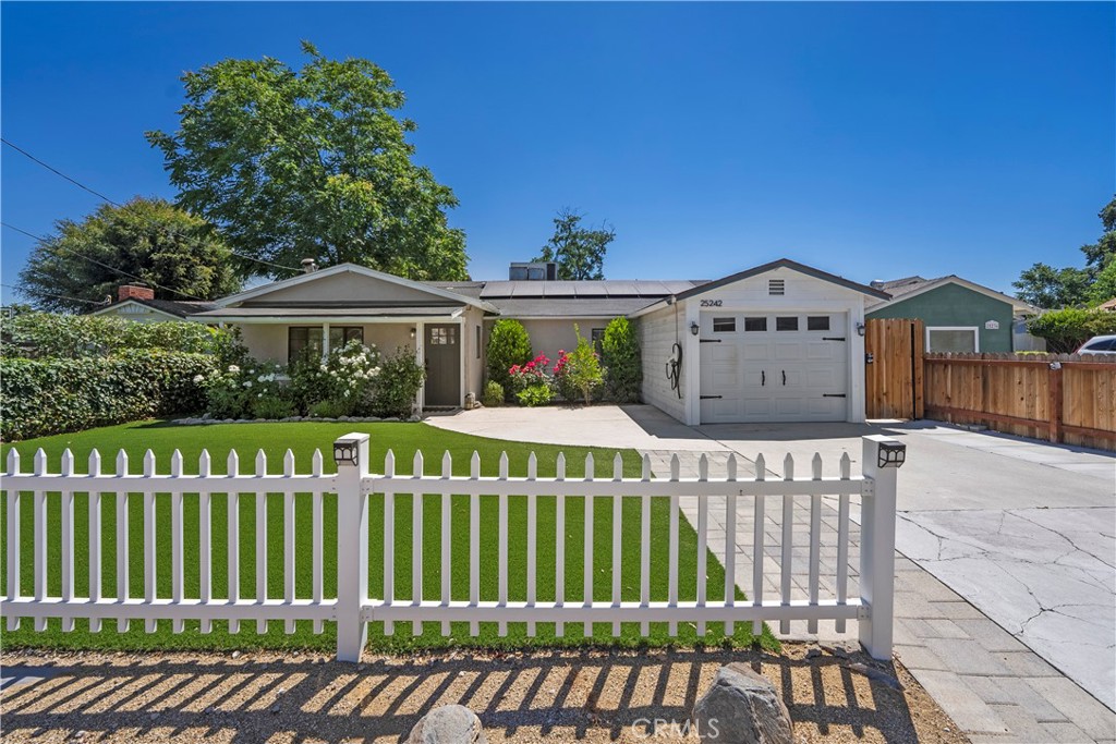 25242 De Wolfe Road Newhall, CA 91321 - Photo 1 of 1 a view of a house with a wooden deck
