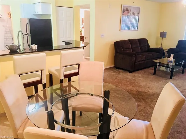 a living room with couches and furniture