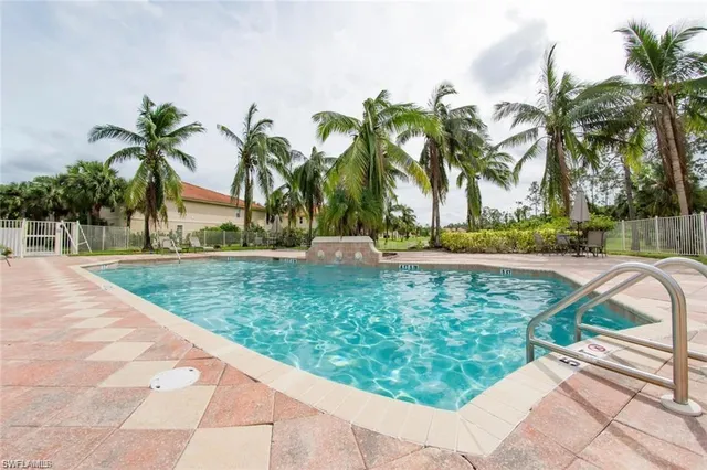 a view of a yard with palm trees