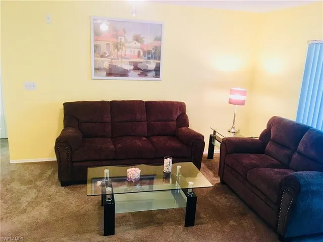 a living room with furniture and a couch