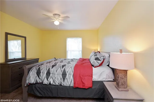 a bedroom with a bed and window