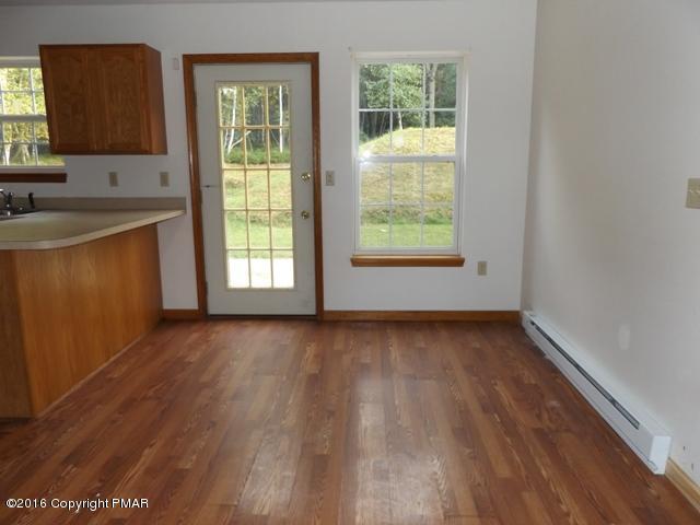 618 Mountain Road Albrightsville, PA 18210 - Photo 5 of 14 a view of a kitchen with wooden floor and a sink