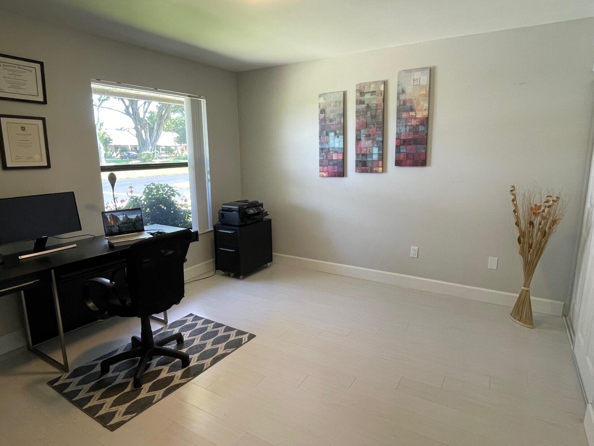 8471 Boca Glades Boulevard East Boca Raton, FL 33434 - Photo 16 of 29 a living room with furniture window and a window