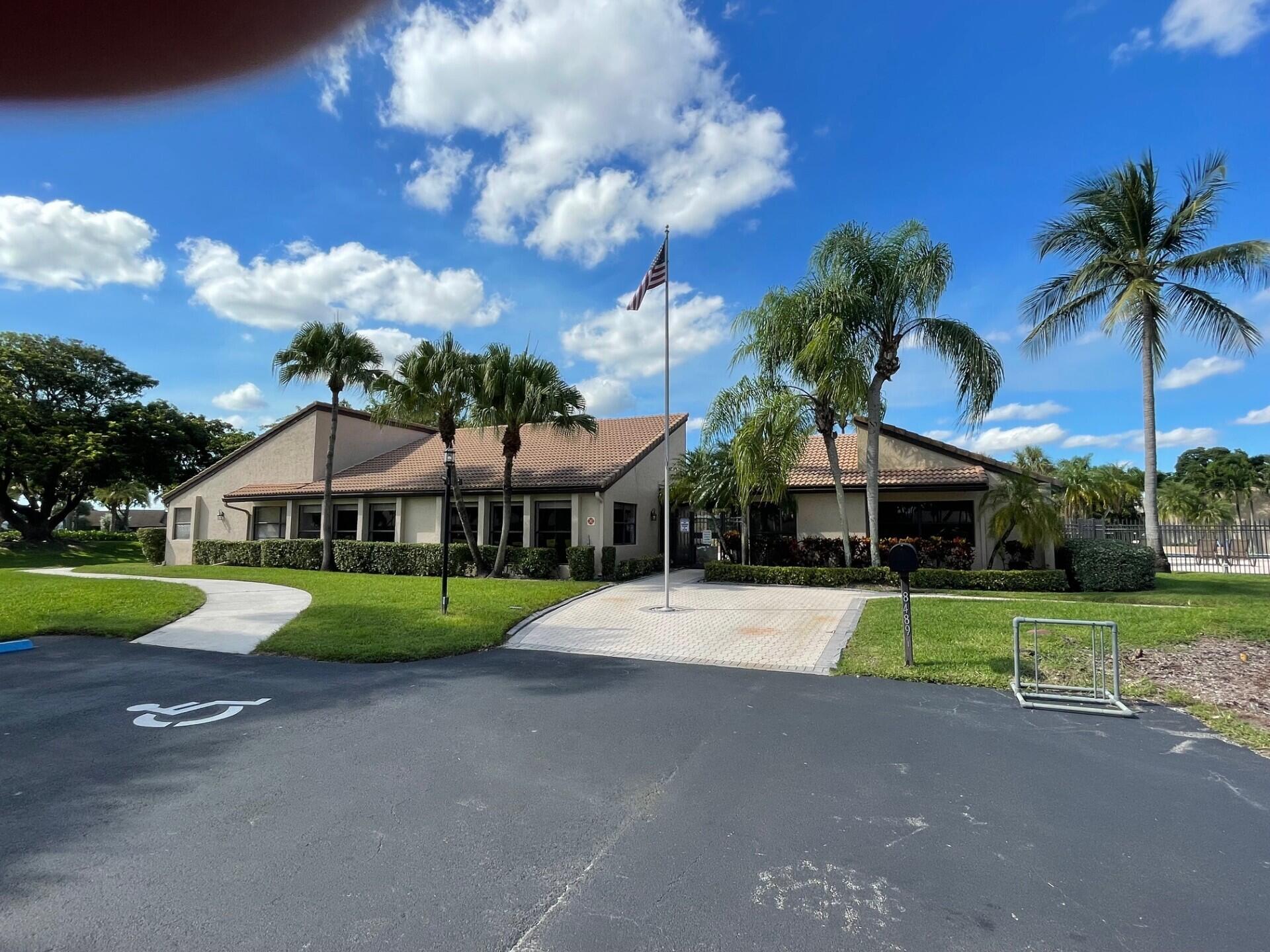 8471 Boca Glades Boulevard East Boca Raton, FL 33434 - Photo 17 of 29 a front view of a house with garden