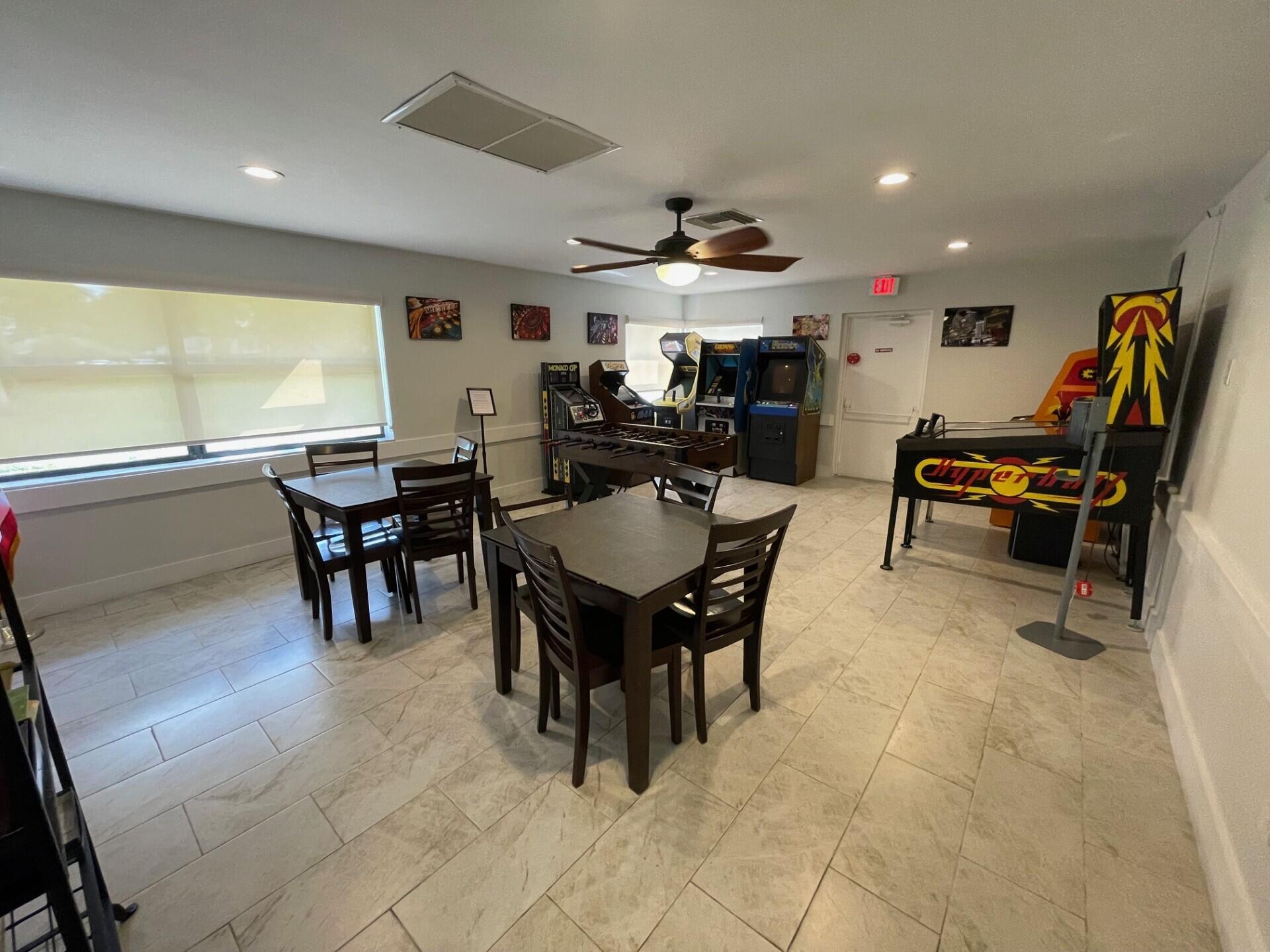8471 Boca Glades Boulevard East Boca Raton, FL 33434 - Photo 25 of 29 a living room with lots of furniture and a large window