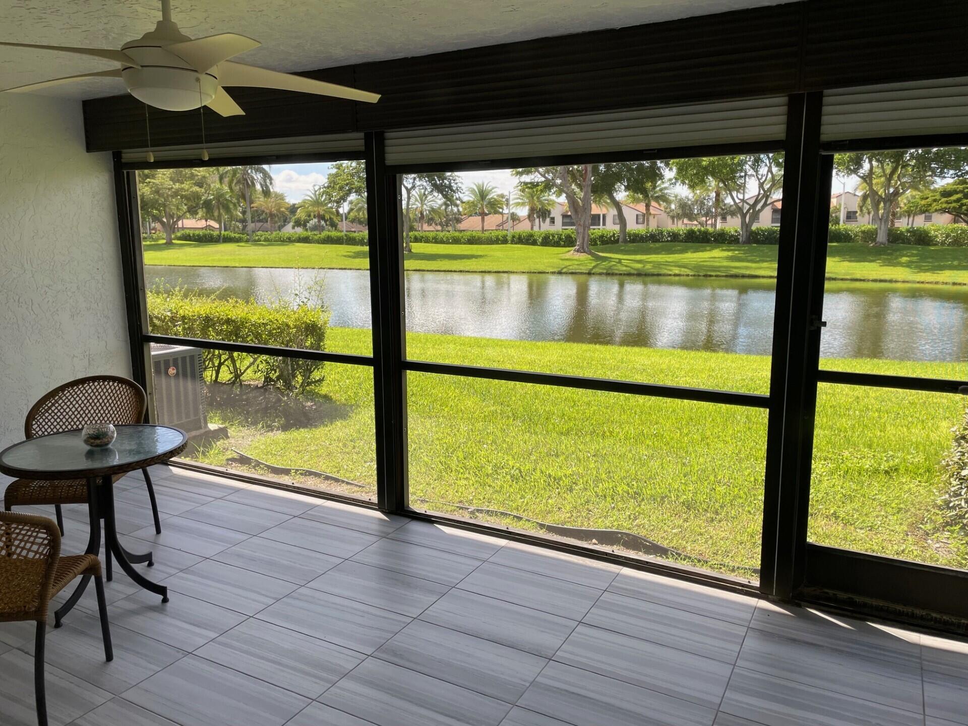 8471 Boca Glades Boulevard East Boca Raton, FL 33434 - Photo 9 of 29 a view of two chairs and a table