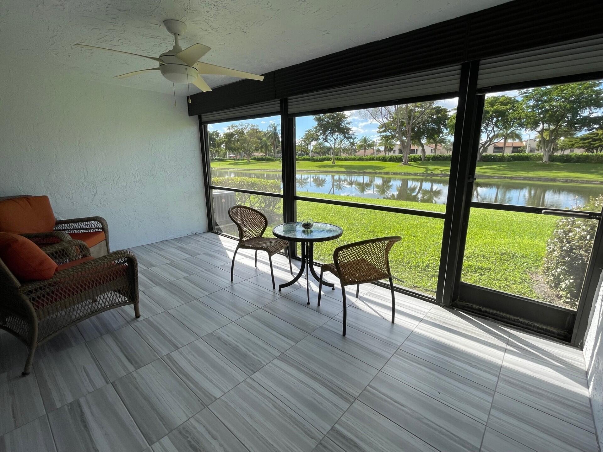 8471 Boca Glades Boulevard East Boca Raton, FL 33434 - Photo 10 of 29 a view of a room with furniture and a large window