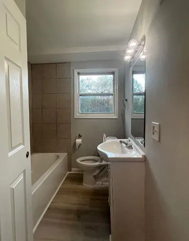 a bathroom with a sink and a bathtub