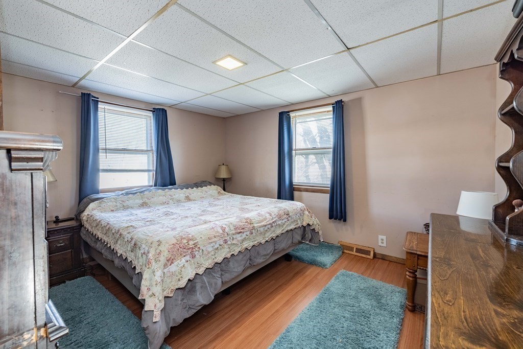 90 Rochester Street Chicopee, MA 01020 - Photo 15 of 31 a bed sitting in a spacious bedroom next to a window