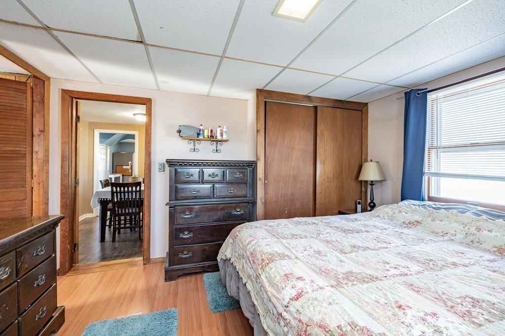 90 Rochester Street Chicopee, MA 01020 - Photo 16 of 31 a bedroom with a bed and a dresser