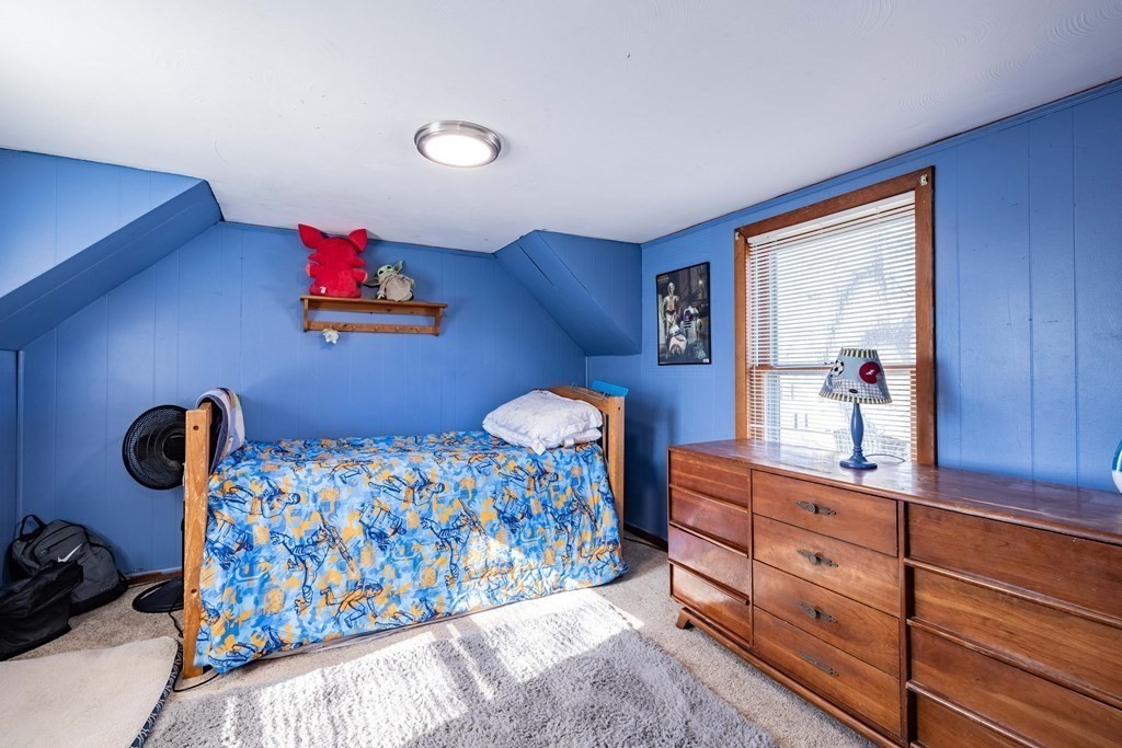 90 Rochester Street Chicopee, MA 01020 - Photo 20 of 31 a bedroom with bed and wooden floor