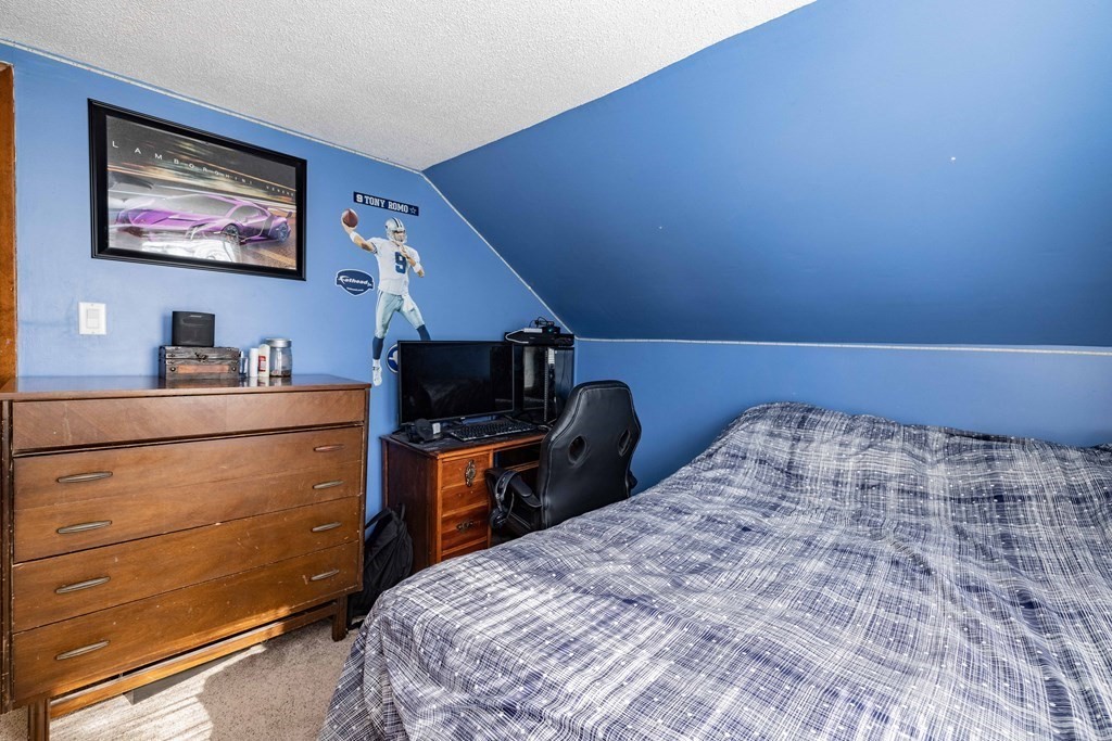 90 Rochester Street Chicopee, MA 01020 - Photo 23 of 31 a bedroom with a bed and furniture