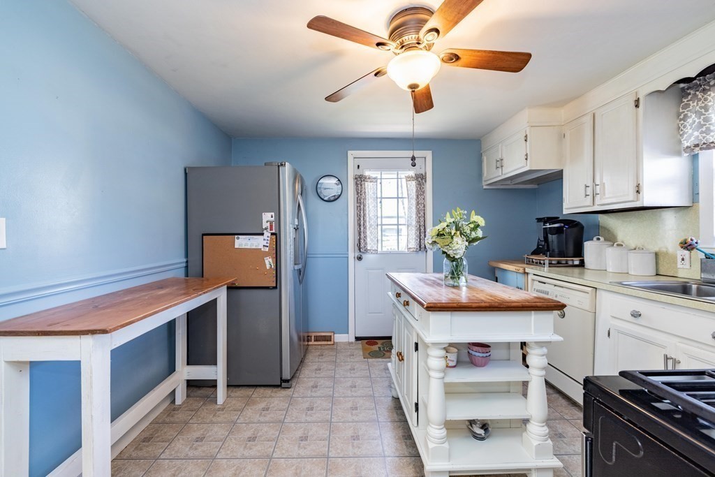 90 Rochester Street Chicopee, MA 01020 - Photo 5 of 31 a kitchen with appliances cabinets and furniture