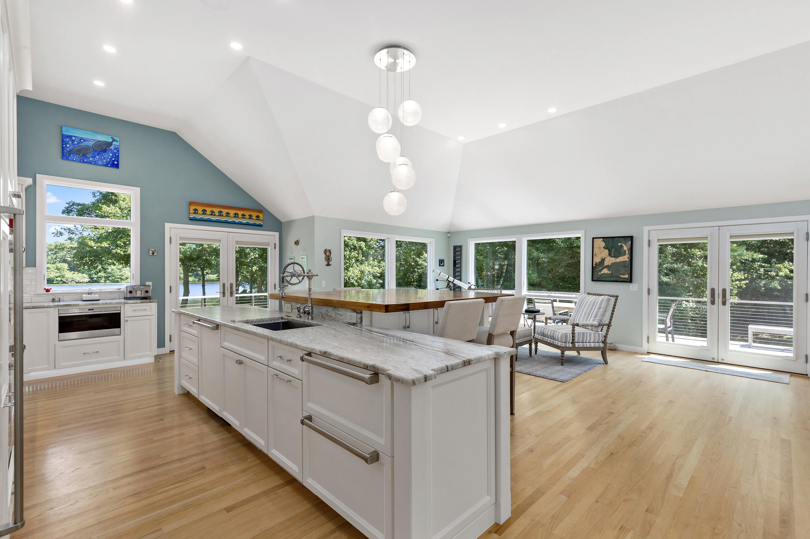 625 Samoset Road Eastham, MA 02642 - Photo 14 of 77 a view of living room kitchen with large windows and furniture
