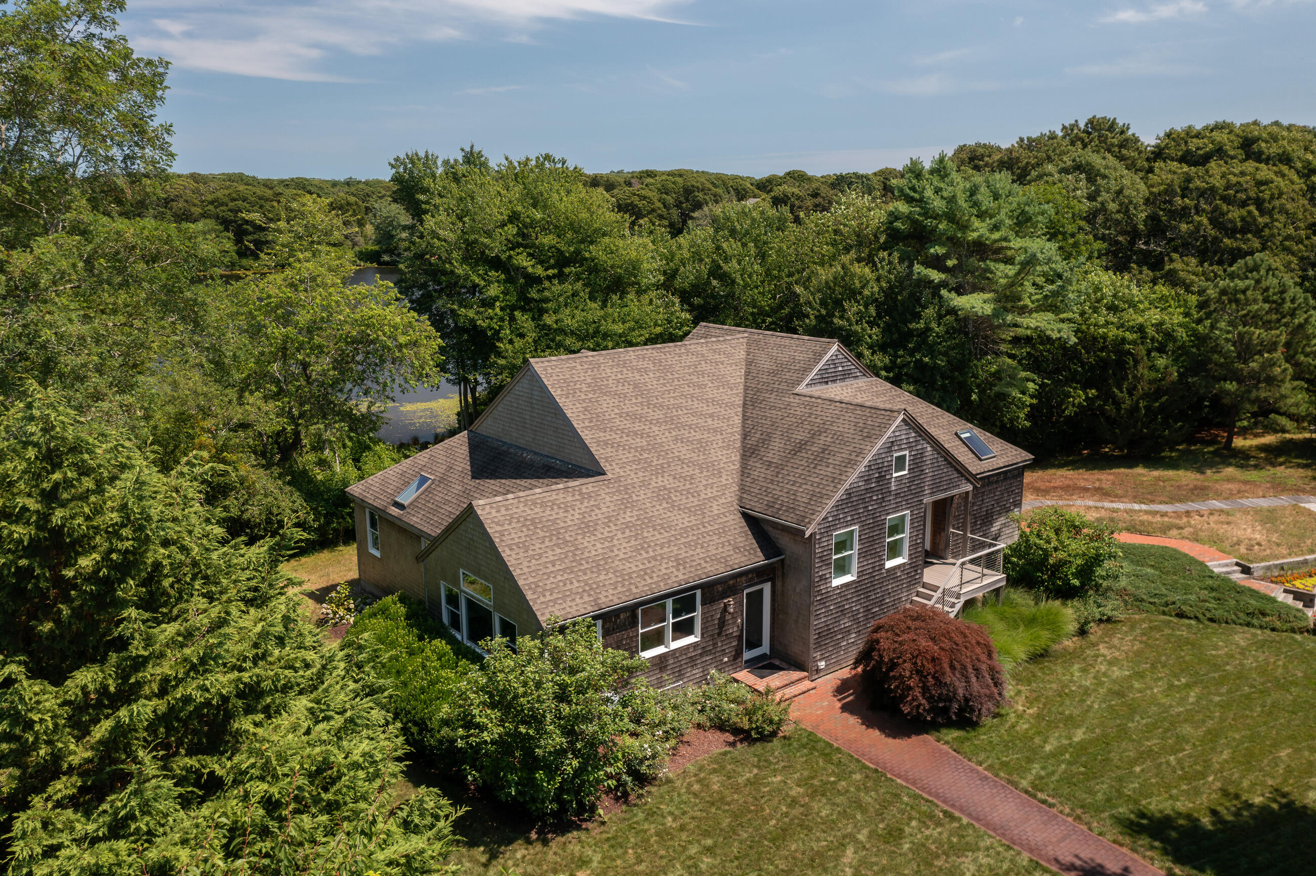 625 Samoset Road Eastham, MA 02642 - Photo 56 of 77 an aerial view of a house around side of green field
