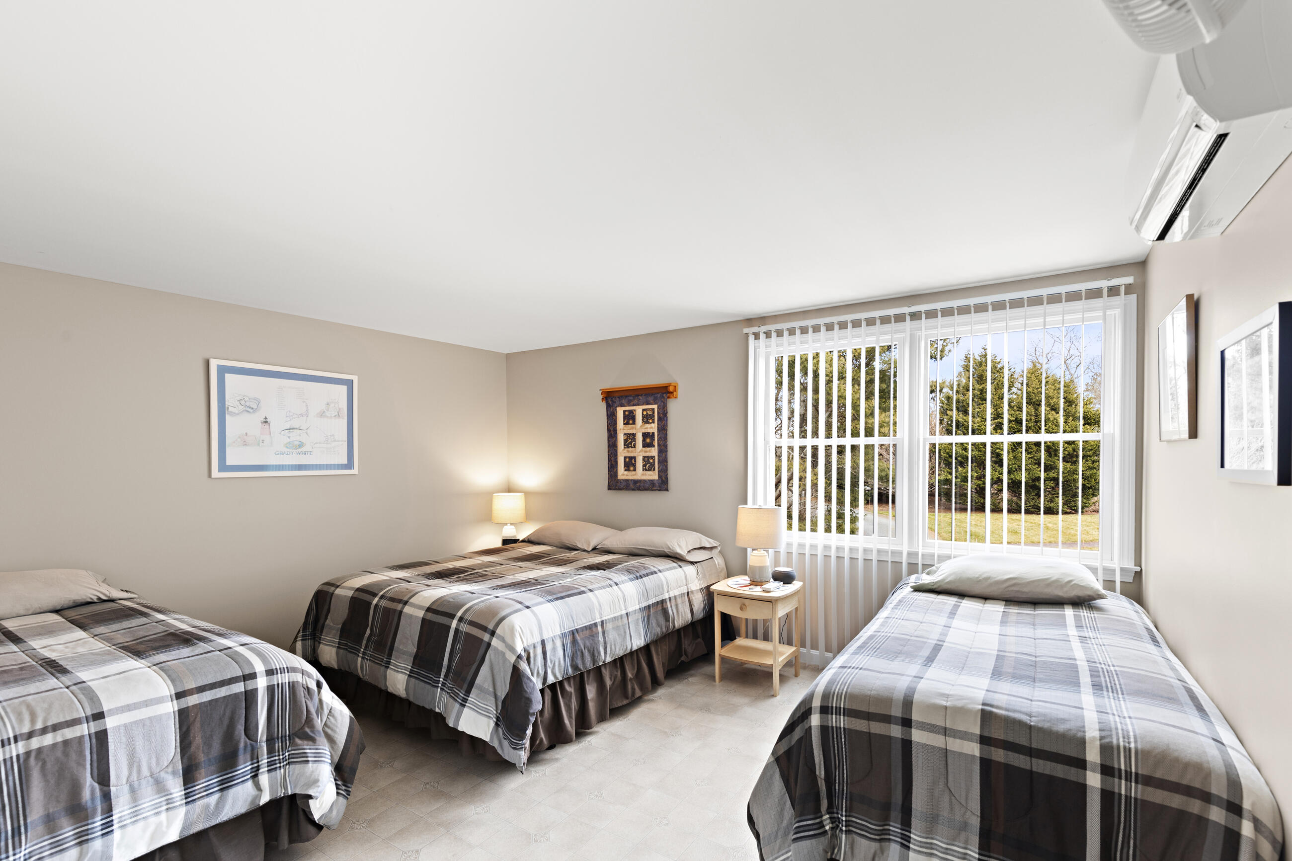 625 Samoset Road Eastham, MA 02642 - Photo 73 of 77 a bedroom with a bed lamp and a window