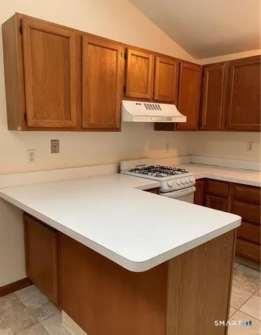 a kitchen with a cabinets and window