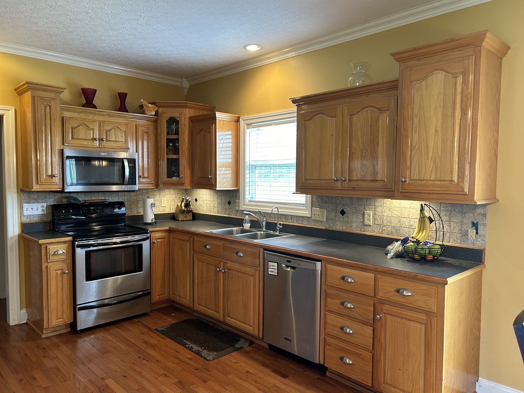 3421 George Olive Road Iron City, TN 38463 - Photo 23 of 51 a kitchen with stainless steel appliances granite countertop a sink and cabinets