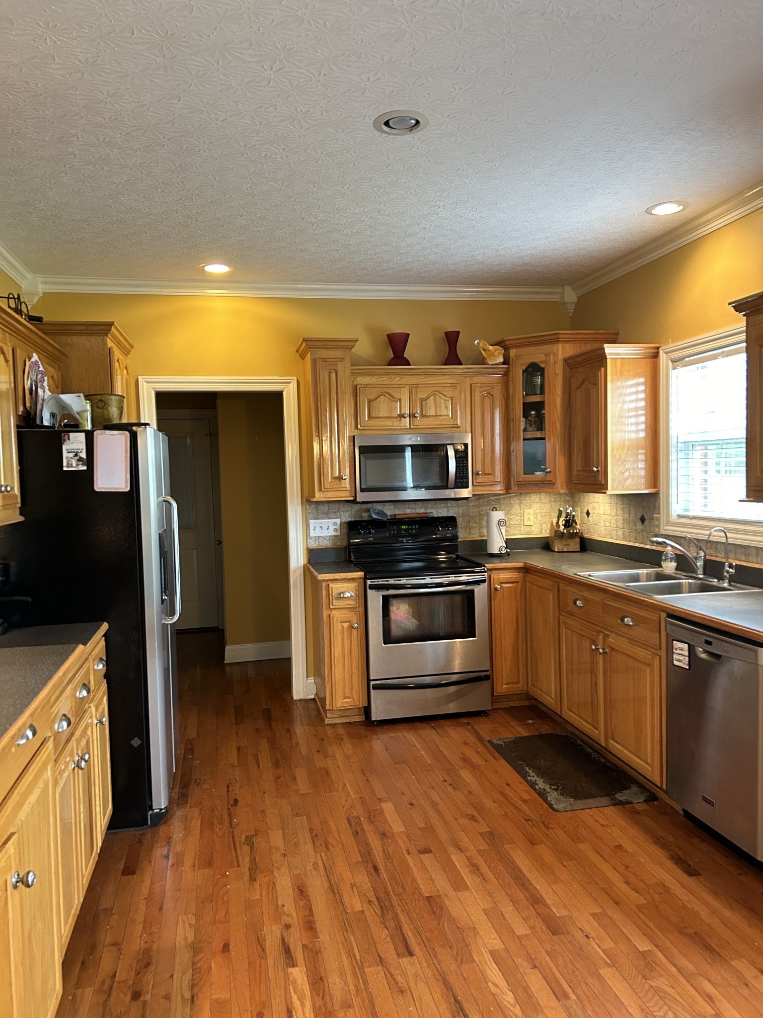 3421 George Olive Road Iron City, TN 38463 - Photo 25 of 51 a kitchen with stainless steel appliances kitchen island wooden cabinets and granite counter tops