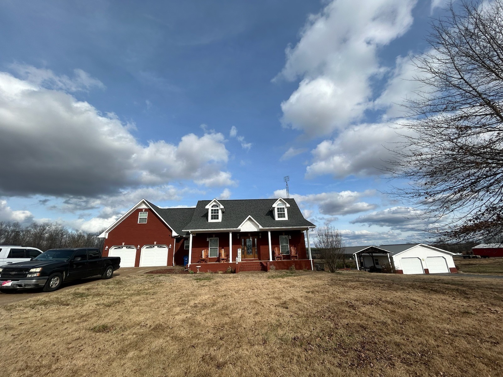 3421 George Olive Road Iron City, TN 38463 - Photo 5 of 51 a front view of a house with a yard and garage