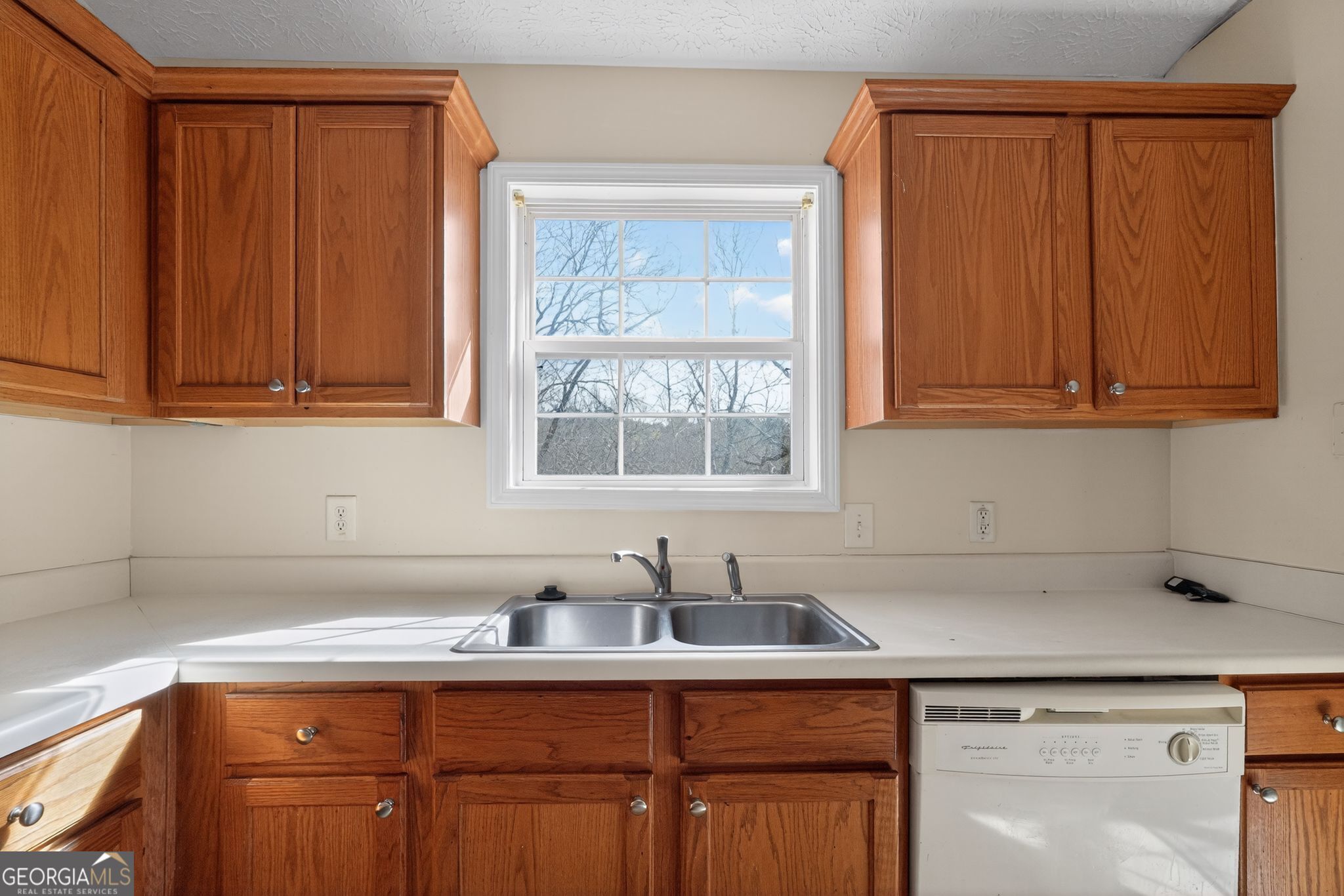 3255 River Run Trail Decatur, GA 30034 - Photo 19 of 37 a kitchen with stainless steel appliances granite countertop wooden cabinets a sink and a granite counter