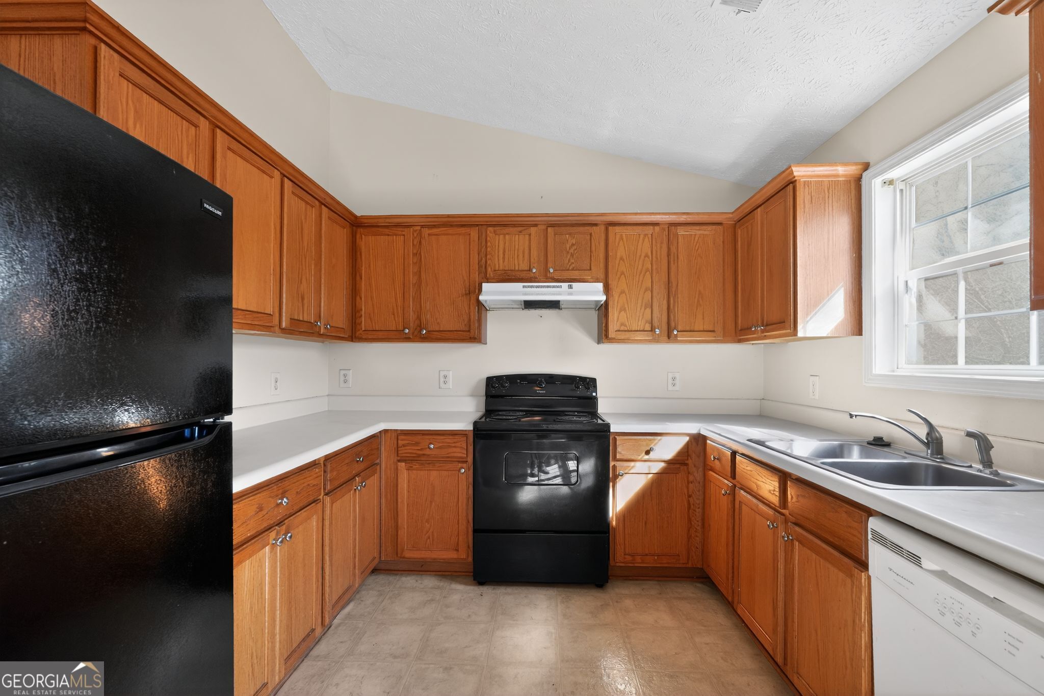 3255 River Run Trail Decatur, GA 30034 - Photo 20 of 37 a kitchen with a sink stove and cabinets