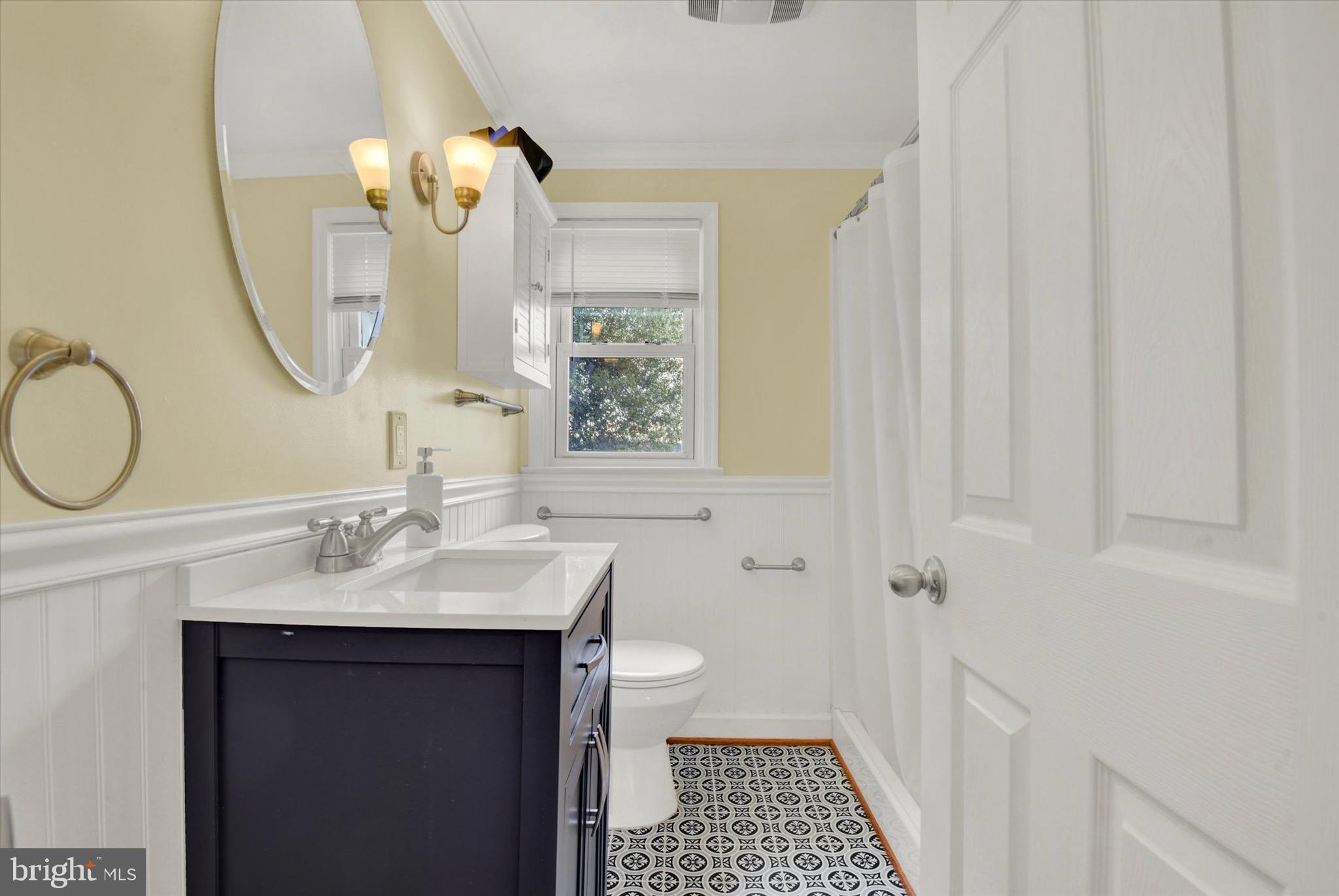 19638 Graystone Road White Hall, MD 21161 - Photo 5 of 32 a bathroom with a sink a toilet and a mirror