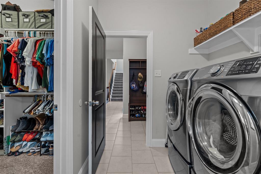 220 Flower Ridge Drive Fort Worth, TX 76108 - Photo 13 of 34 a view of walk in closet with clothes and shoes