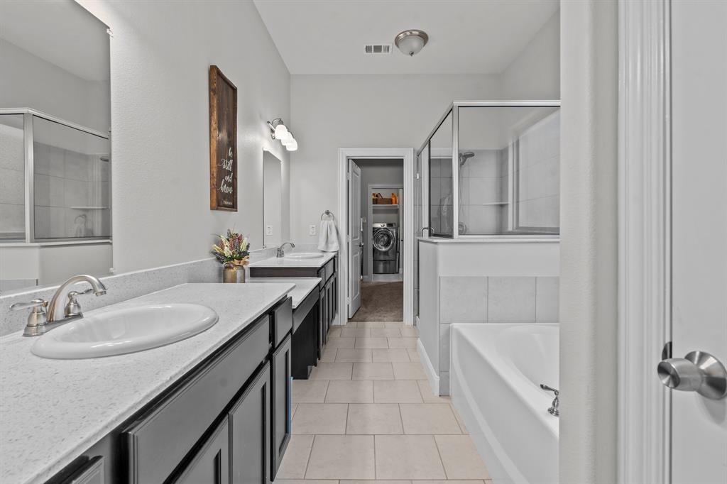 220 Flower Ridge Drive Fort Worth, TX 76108 - Photo 21 of 34 a spacious bathroom with a granite countertop sink a mirror and shower