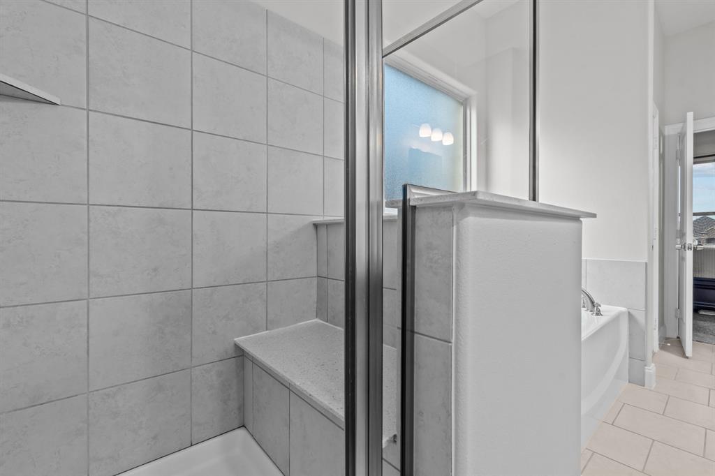 220 Flower Ridge Drive Fort Worth, TX 76108 - Photo 22 of 34 a bathroom with a shower and a mirror