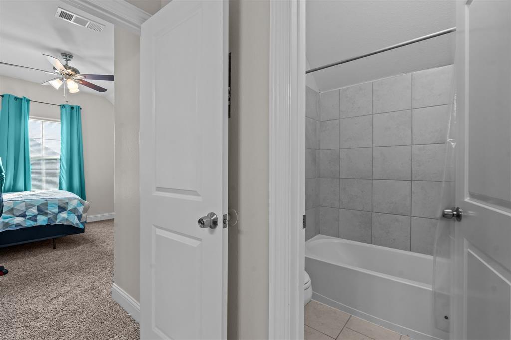 220 Flower Ridge Drive Fort Worth, TX 76108 - Photo 29 of 34 a bathroom with a tub and a shower