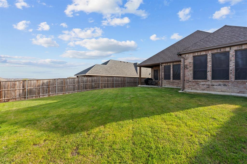 220 Flower Ridge Drive Fort Worth, TX 76108 - Photo 31 of 34 a view of a house with a big yard and a large tree