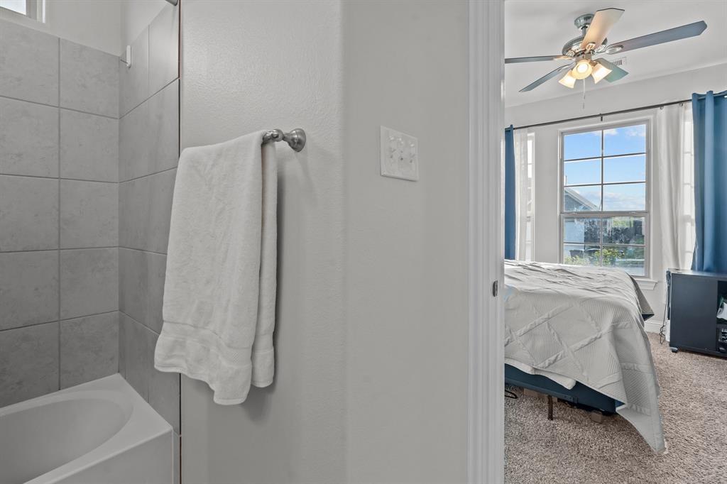 220 Flower Ridge Drive Fort Worth, TX 76108 - Photo 9 of 34 a bathroom with a bathtub and a shower