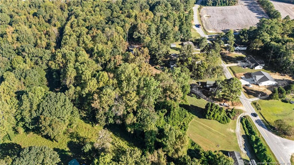 0 Fire Dept Road Smithfield, NC 27577 - Photo 18 of 29 an aerial view of residential house with parking space and covered with trees