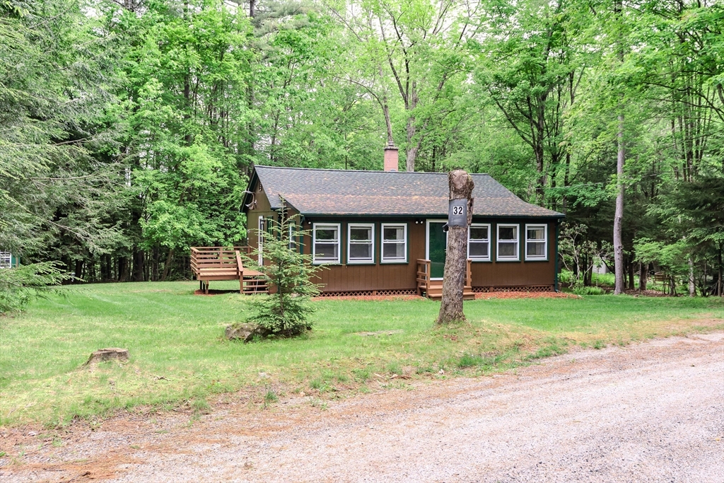 32 Birch Road Goshen, MA 01096 - Photo 3 of 26 a backyard of a house with seating space