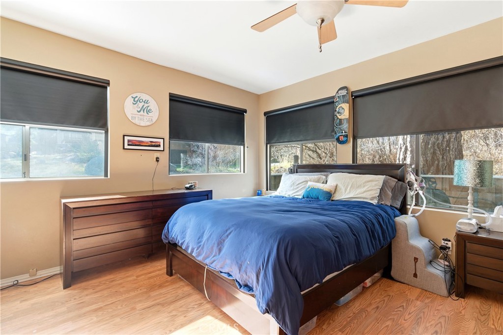 5652 Sycamore Street Wrightwood, CA 92397 - Photo 14 of 50 a bedroom with a bed and large window